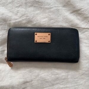 Michael Kors black leather and rose gold zippy wallet